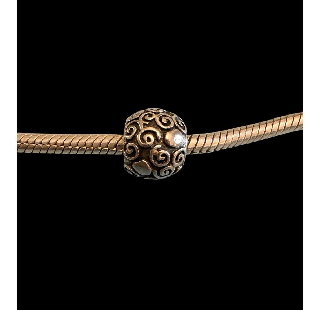 Authentic Pandora stirling silver swirl and dot retired charm